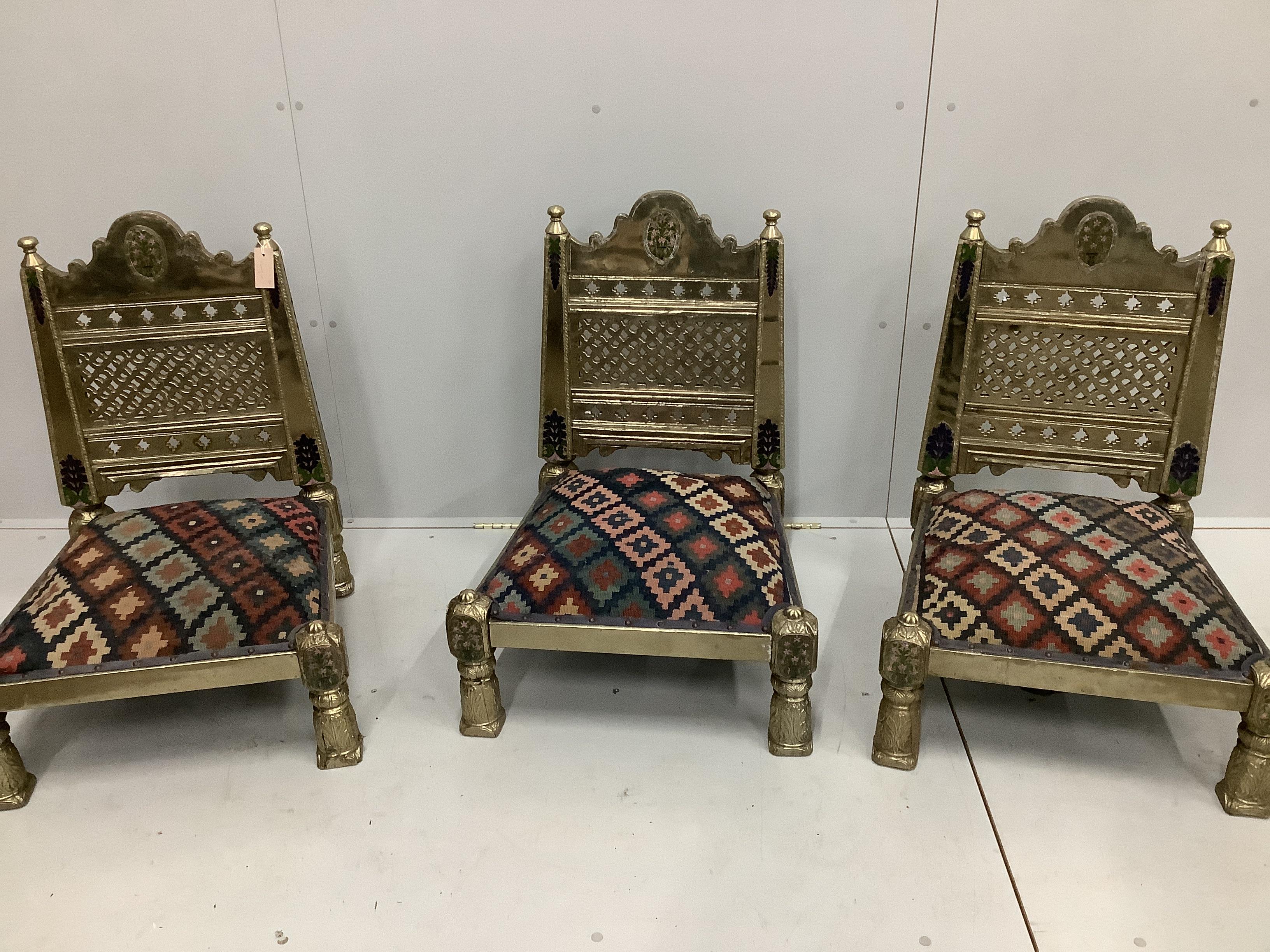 Three Indian metal clad Pidha low chairs with enamelled decoration and Kilim covered seats, width 58cm, depth 55cm, height 75cm